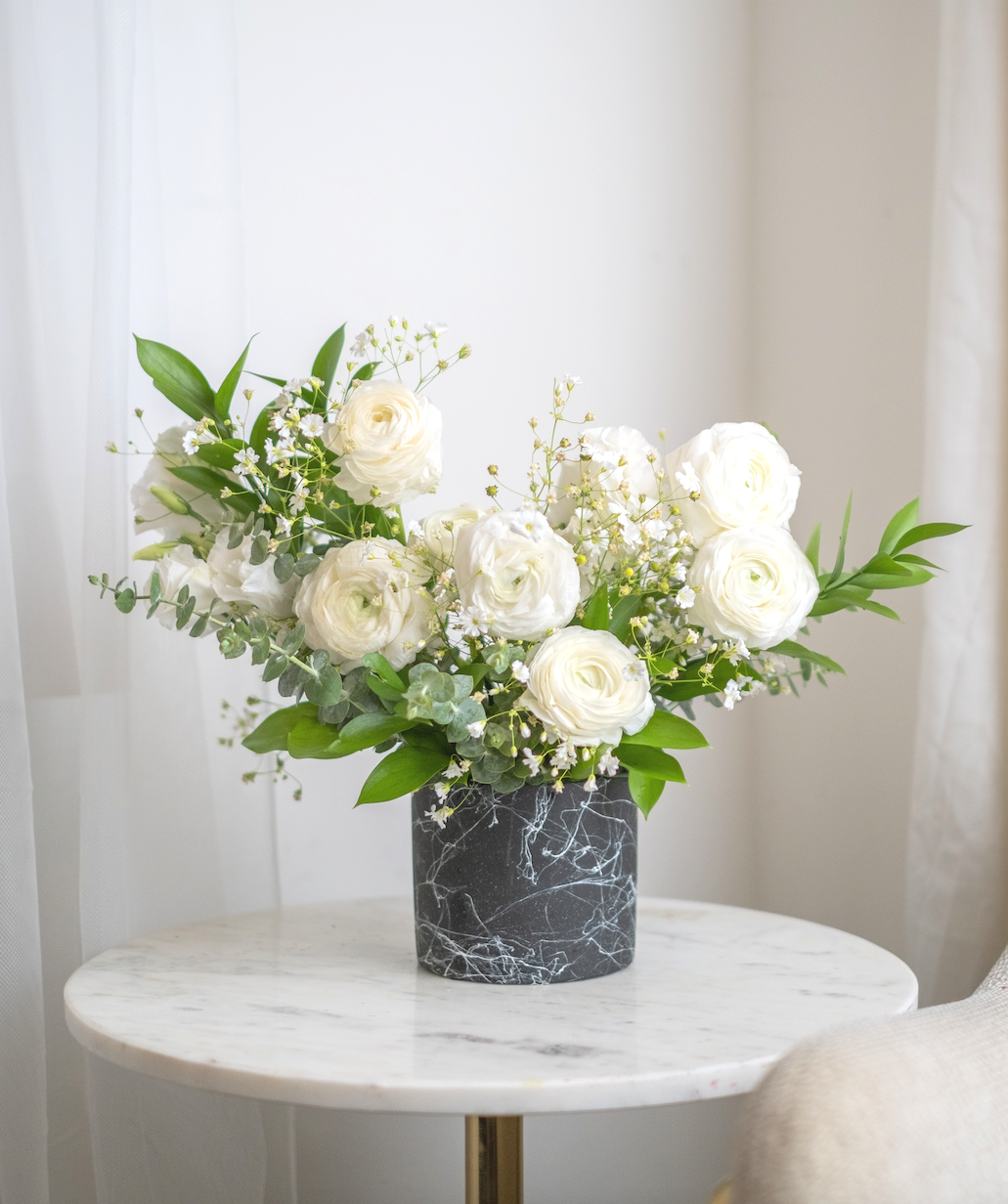 Large inflorescence of white rununculuses fascinate with lightness and airiness and creates luxurious appearance. This is an exquisite composition for the dearest people!